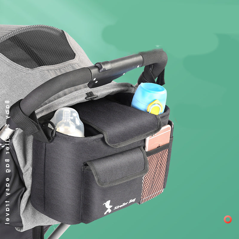 Stroller organizer with cup holder and pockets on a green background
