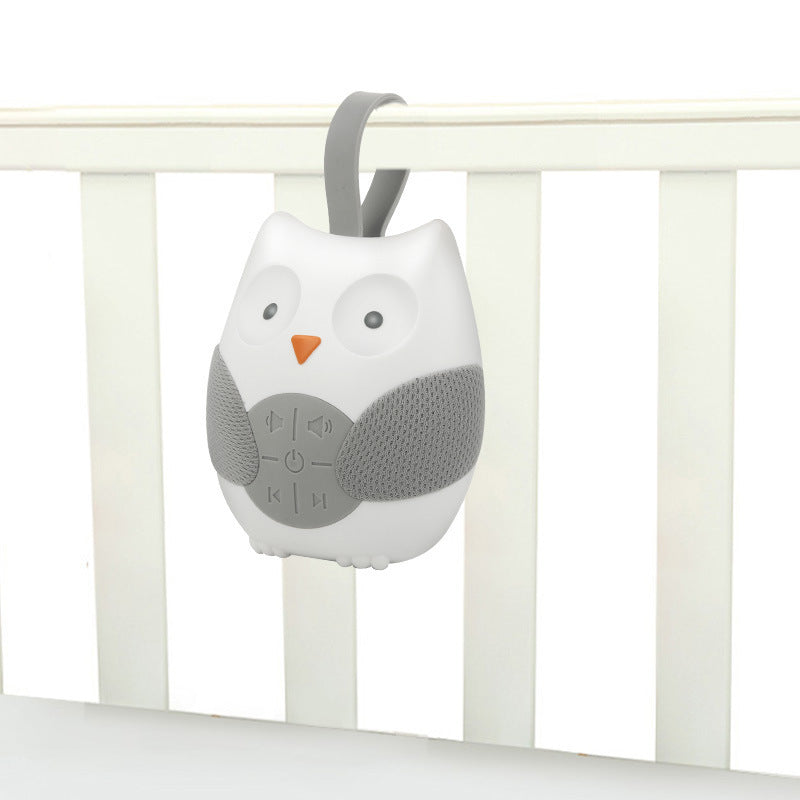 Gray owl-shaped baby monitor attached to a crib rail