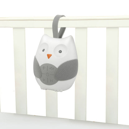 Gray owl-shaped baby monitor attached to a crib rail