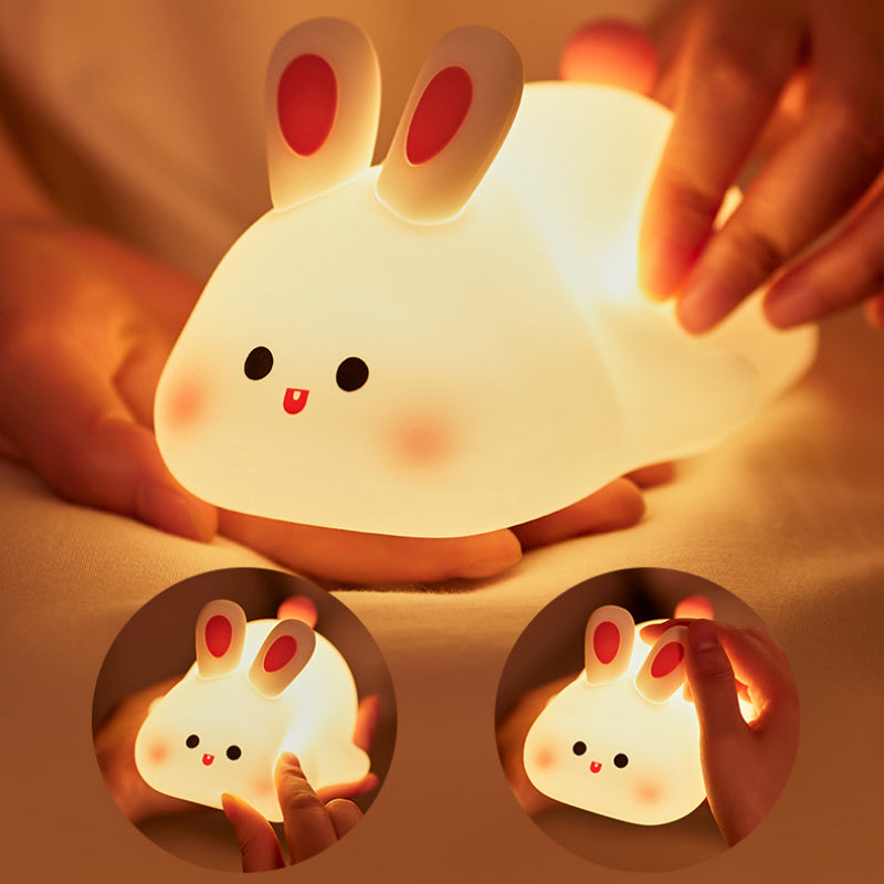hand holding rabbit lamp