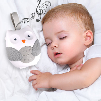 Baby sleeping peacefully with an owl-shaped white noise machine next to them.